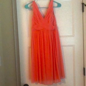 Womens size 4 David’s Bridal dress only worn once. Has a back sash.